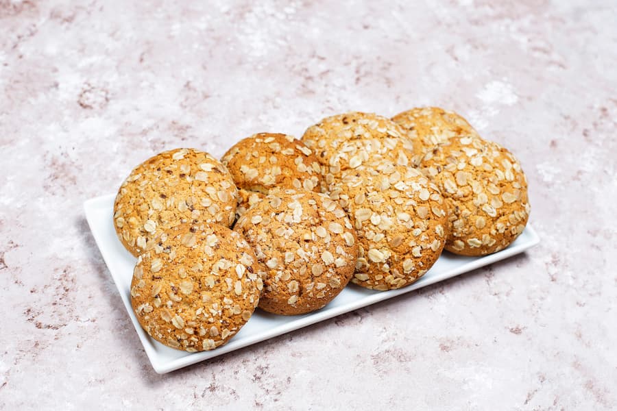 Soft banana oat cookies on a white plate, a healthy homemade school snack