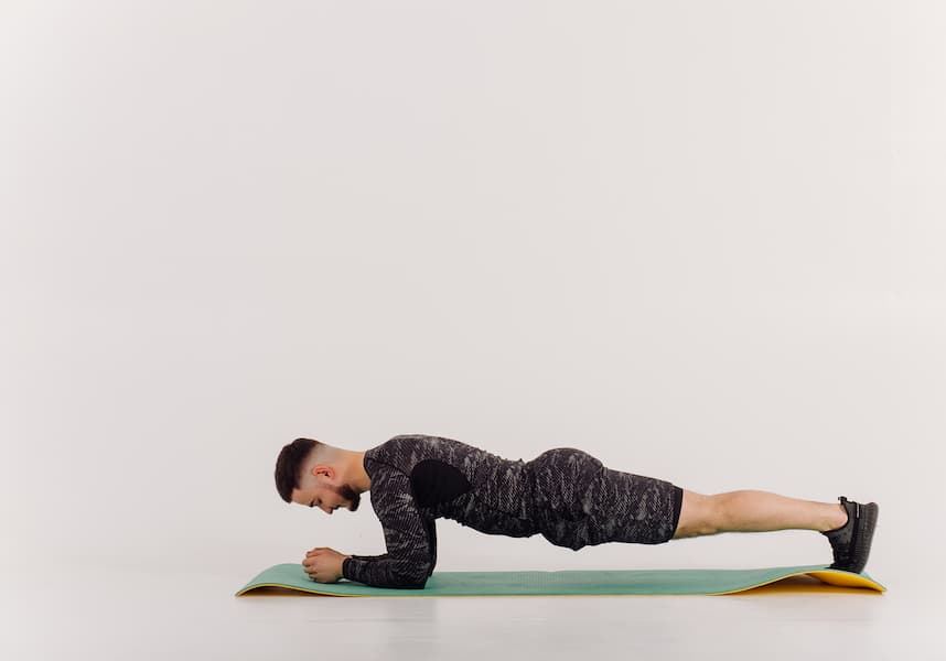 Young man doing push-ups on the floor