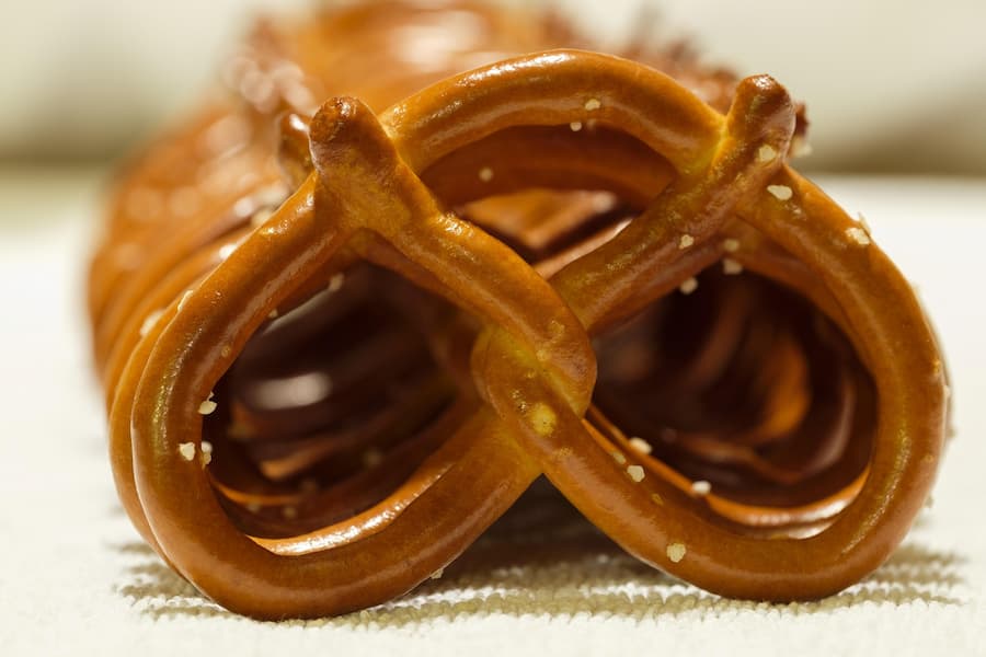 Close-up of a single salted hard pretzel with a golden brown crust