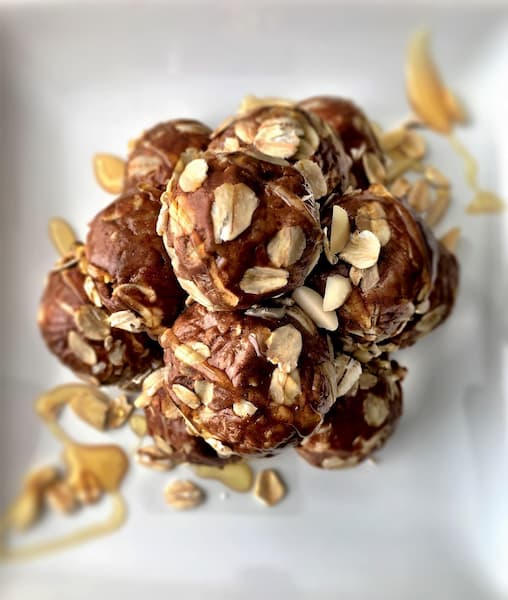Homemade energy bites with oats and peanut butter drizzle