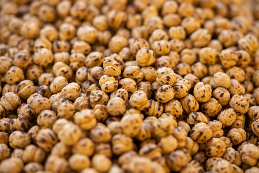 Close-up of a pile of golden-brown roasted chickpeas.
