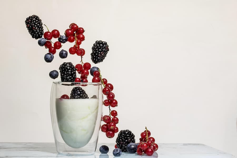 yogurt in a glass with fresh berries healthy snack for kids