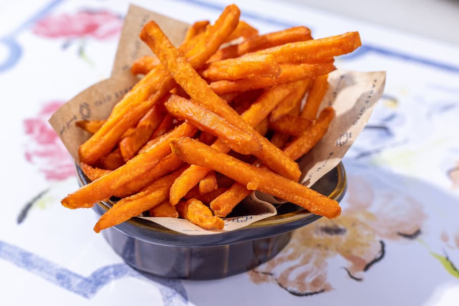Crispy sweet potato fries served in a bowl