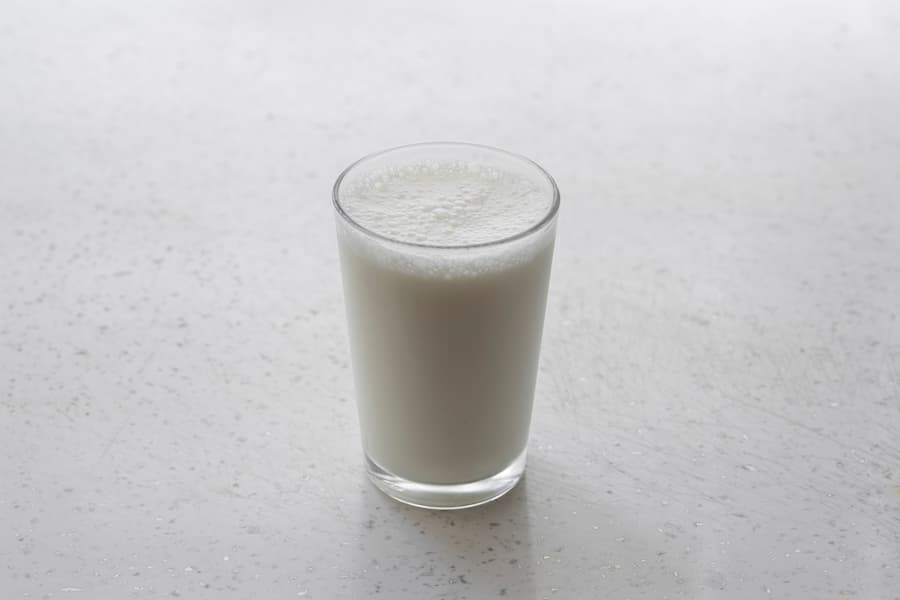 A glass of milk on a light table
