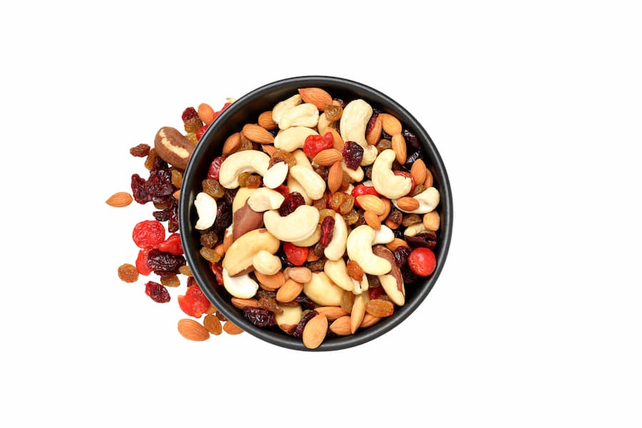 healthy snacks from the gas station including a bowl of mixed nuts and dried fruit