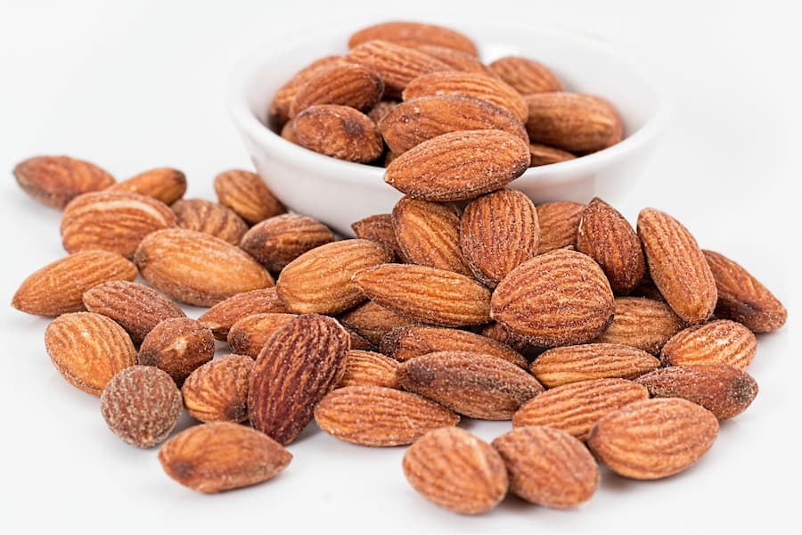 Bowl of unsalted almonds and walnuts as a heart healthy snack