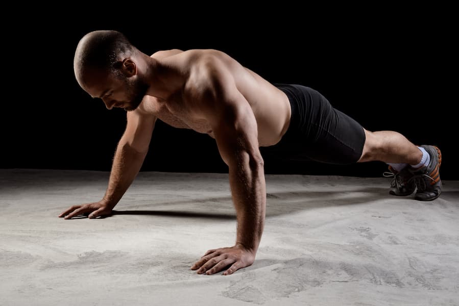 Man doing a wide -hand push up exercise